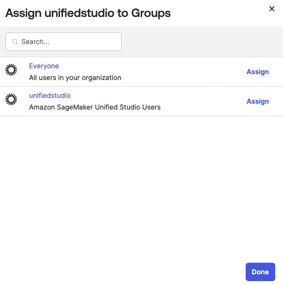 Screenshot of Okta group assignment interface showing unifiedstudio group selection